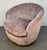 Add timeless style and comfort to your space with this elegant vintage barrel swivel chair. Upholstered in a soft blush-...