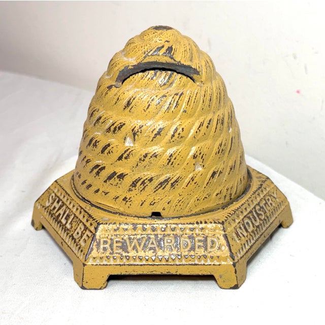 Up for sale is an rare antique early 1900's "Industry Shall Be Rewarded" Bee Hive Still Bank made of cast iron. This...