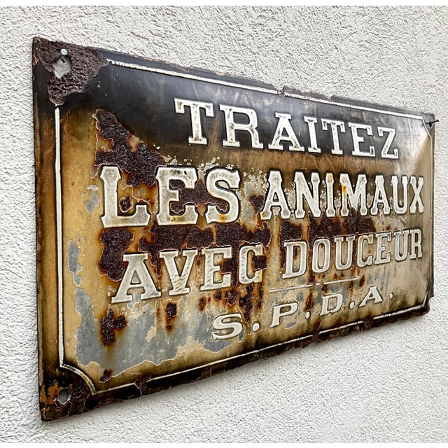 Rare early 20th-century belgian enamel sign bearing the french animal protection message: “traitez les animaux avec...