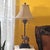 Vintage Berman table lamp featuring a sculpted camel figure on a stepped base with palm-inspired metal detailing and a...