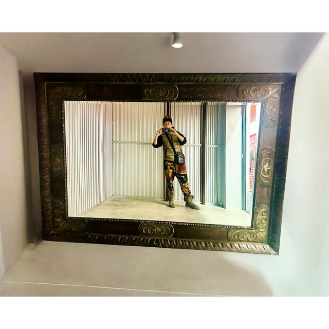 This HOWARD ELLIOT COLLECTION Ornate Bevel Wall Mirror comes from Long Island Estate.