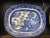 A rare collection of three 19th-century English Blue Willow ironstone serving platters featuring the iconic chinoiserie...
