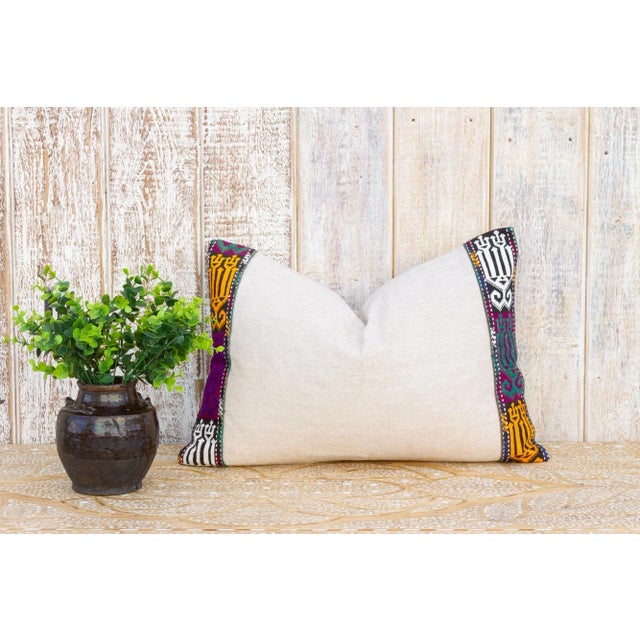 This linen pillow is flanked by rare antique tribal borders, it is bordered by hand-woven, ply-split camel girth lace and...