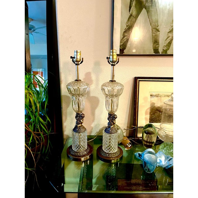 Pair of Cut Crystal and Brass Waterford table lamps. Hollywood Regency, 1940’s. Beautiful Cherubs at focal point. Electric...