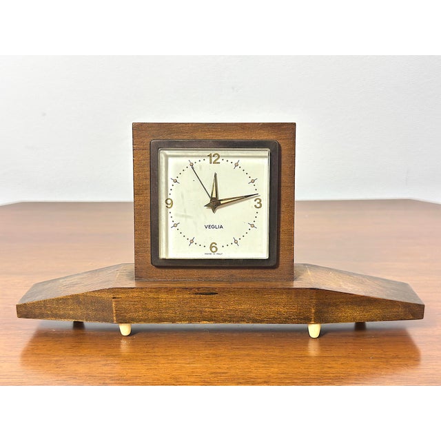This clock perfectly embodies the understated elegance of post-war Italian design. The structure is composed of a central...