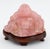 Collection of Seven Chinese Carved Pink Rock Crystal Sculptures, comprising: seated Buddha mounted on ebonized wood base,...