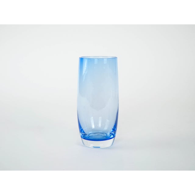 The set of glasses was made in the 1980s in Italy. A set of six tall glasses with thick, stable bases, made of transparent...