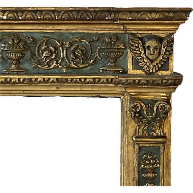 This mid 18th century Italian Tuscan Neoclassical Mirror features an architectural carved wood frame richly decorated with...