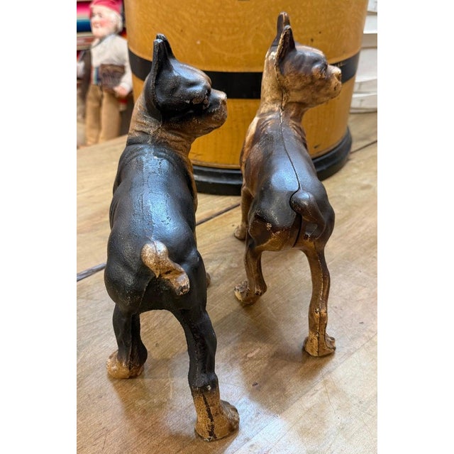 Set of two cast iron Hubbly pit bull terrier door stops. Black and white dog measures - 10 high x 7.5 length x 4.5 depth...