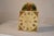 Late 19th century metal clock face from England. the design and numbers are hand painted. At the top, there is a figure of...