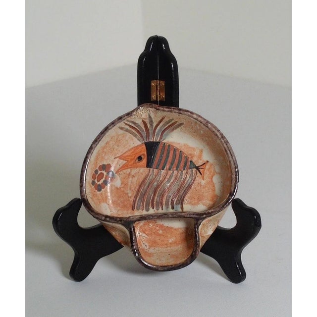 Hand-painted Portuguese pottery bowl by Ceramicarte Cascais featuring a whimsical fish motif in warm terracotta, cream,...