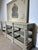 Enhance your interior with this beautiful patinated console table , finished in a timeless off-white hue . This piece...