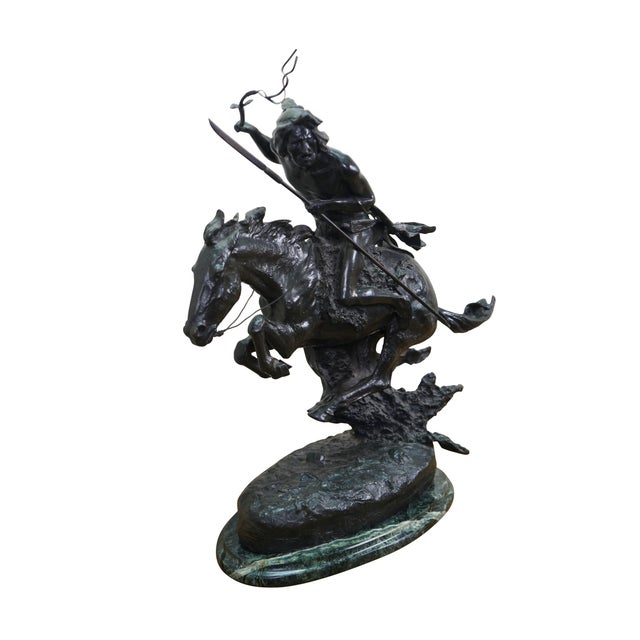 Mid century Frederic Remington bronze sculpture titled The Cheyenne, produced by Roman Bronze Works, New York. The...
