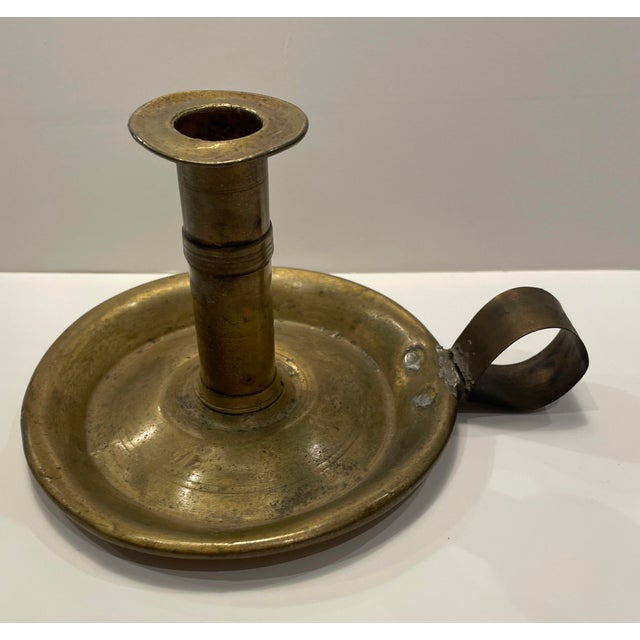 19th century brass chamber stick, most probably British. Umarked. Shipping times are significantly shorter than Chairish...