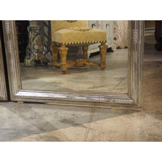 More information coming soon… Measuring 71 inches tall, this pair of French mirrors is a grand example of the highly...