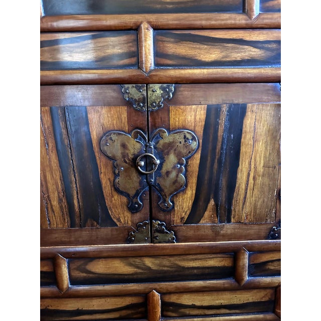 Known as Ich'ung Jang in Korean, this large chest features a double-level storage space chests with frontal open doors on...