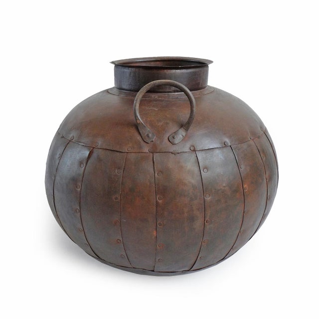 Iron rivet pot from North India. Originally used for water transport. Great for display indoors or out. Each slightly...
