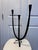 Hand-forged wrought iron candelabra with a Brutalist, Spanish Modern feel. Three asymmetric trumpet-form candle cups,...