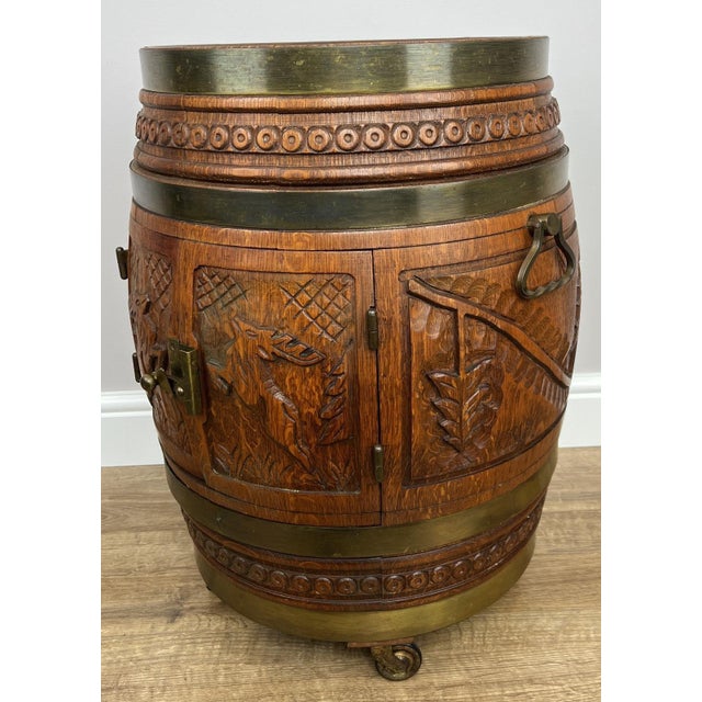 A wonderfully unique Vintage French barrel drink cabinet , beautifully crafted with rich oak tones and striking carved...