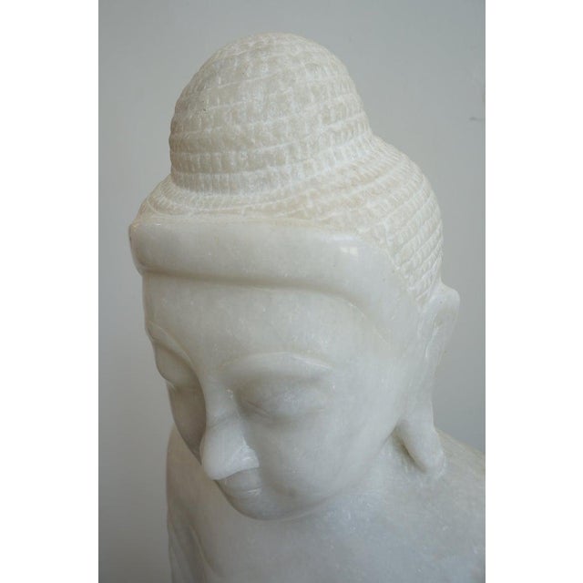 Vintage Standing Buddha Mandalay Style in Carved White Marble from a Palm Beach estate This beautiful hand-carved white...