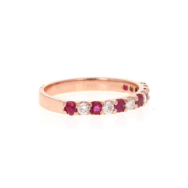 Elegant and classy 0.69 Carat Diamond and Ruby band that is sure to be a great addition to your collection! There are 6...