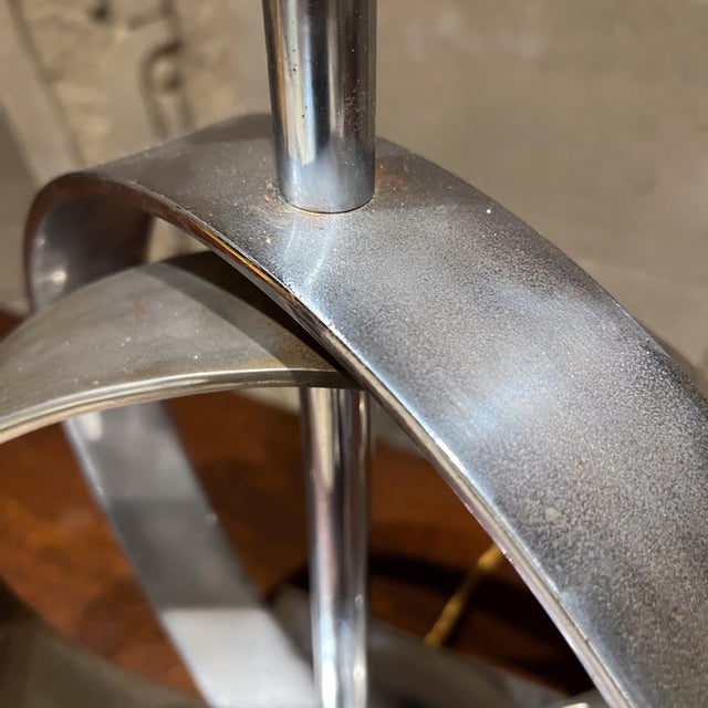 AMBIANIC presents 1970s Unique Sculpturally Shaped Chrome Lamp Concentric rings on square chrome base. Unmarked 20.5 h x...