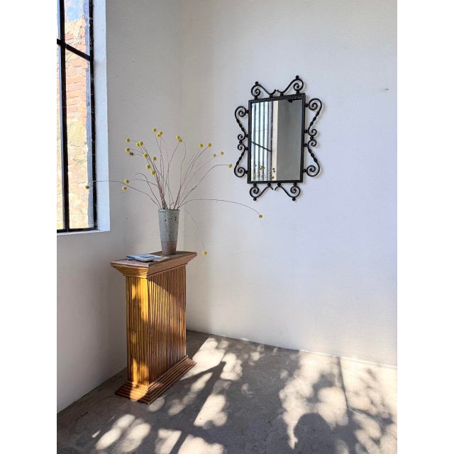 Vintage wrought iron mirror in a brutalist style from the 1940s. we love the overall patina, with the black-stained iron...