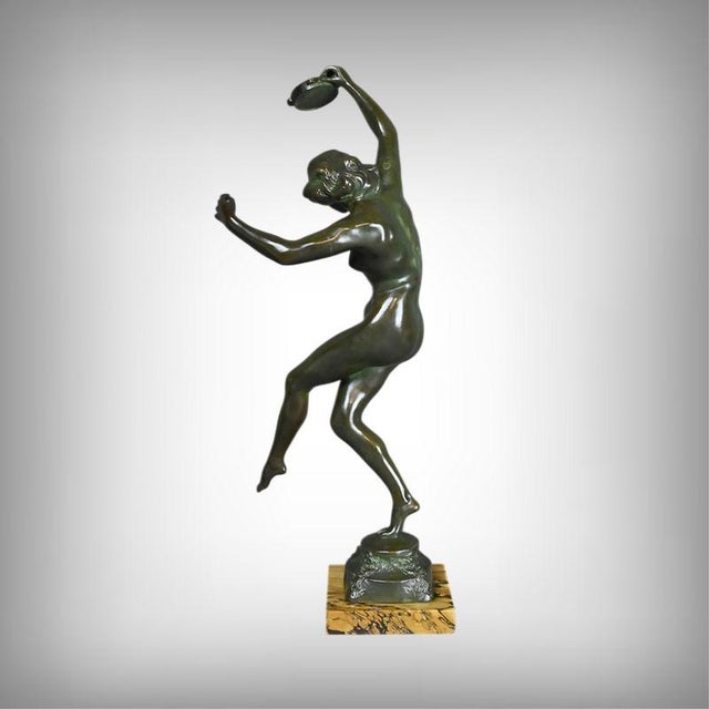 This superb bronze, entitled "The Tambourine Dancer" and signed C. Binder, depicts a female figure in full motion,...