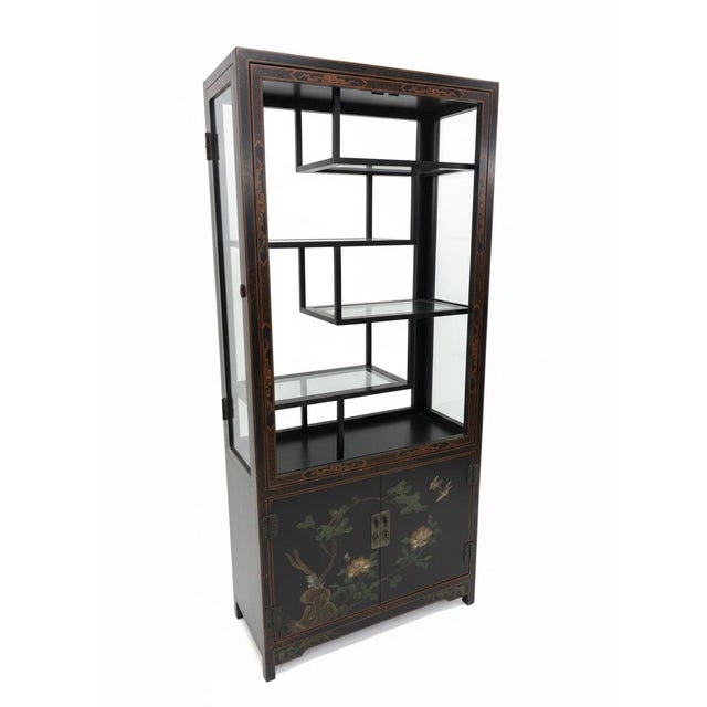 Elevate your collection with this exquisite Chinoiserie-style vitrine cabinet. Finished in a deep black lacquer, this...