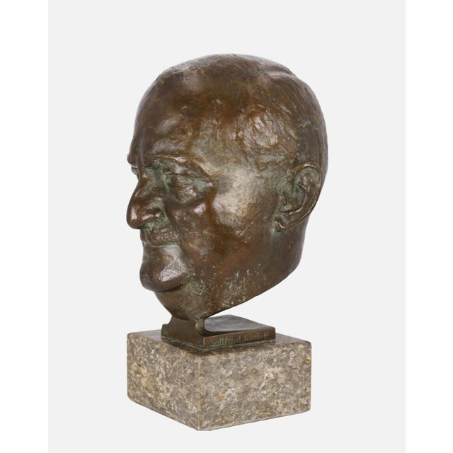 Unidentified artist, Portrait head of Gottfried Bischoff, 1953. Patinated bronze mounted on a natural stone base, 40 cm...