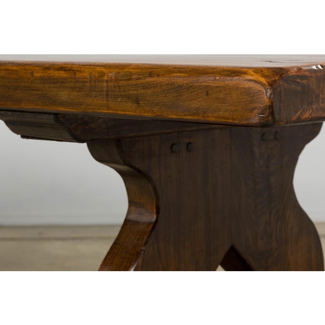 Late 19th century French monastery farmhouse table sourced in Provence, France. Constructed in solid fruitwood, the table...