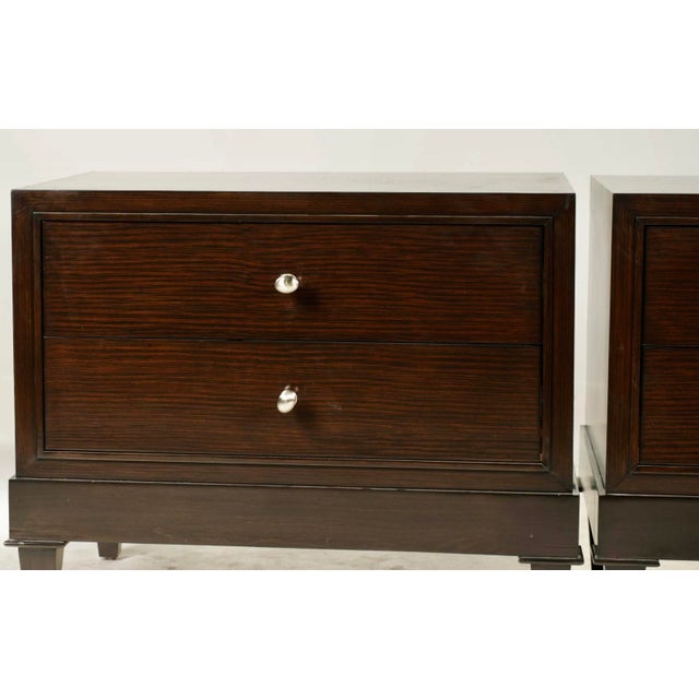 A stunning pair of modernist nightstands with two roomy drawers each — perfect for elevating any bedroom setup. These...