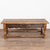 20th century French coffee table, crafted in oak. The table features a carved scalloped skirt, one drawer with an iron...