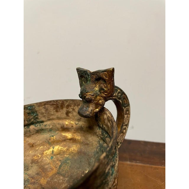 Chinese archaic style gilt bronze pouring vessel with dragon headed handle and geometric decoration. With wonderful gilt...