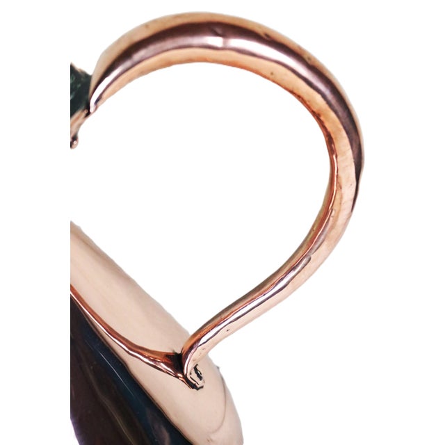 A traditional English copper liquid measure with a two gallon volume dating from the late 19th century. This shape is...