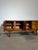 Bring timeless British mid-century style into your home with this elegant teak sideboard by Jentique. Crafted in the...