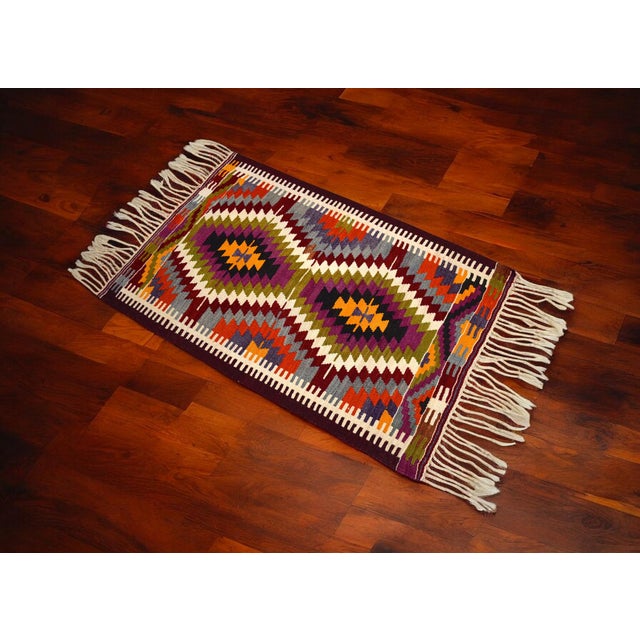 This is a vintage Turkish Antalya Barak patterned Kilim rug made from wool on wool and natural dyes. The rug is in...