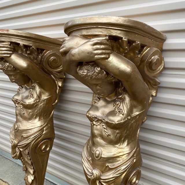 Stunning pair of extra large gilded sconces. Would be extravagant at any entryway alone or to hold large candles or...