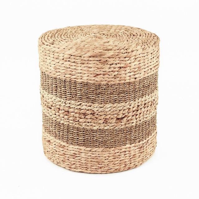 The Woven Cylindrical Stool from Zentique is a handwoven cylinder stool in water hyacinth, seagrass, and corn husk leaf....