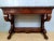 Large Empire period console table in mahogany With a stave belt, it opens on the front with a large drawer capped on top...