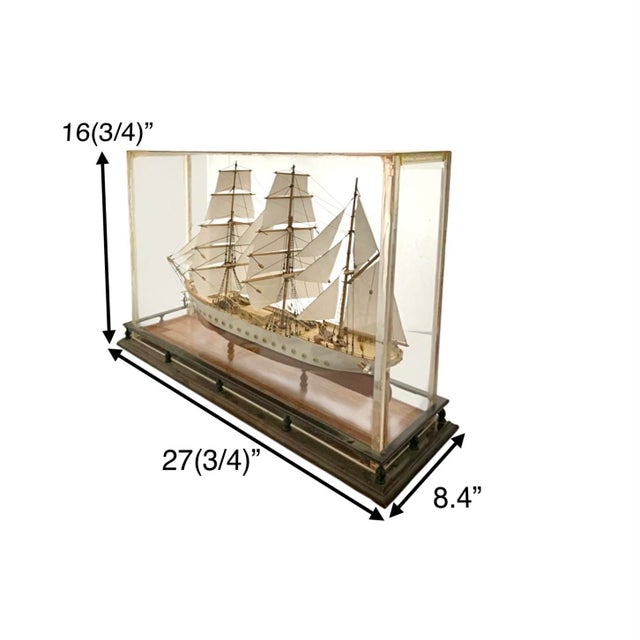 This ship model in display case is handcrafted in the 1960s/1970s this one-of-a-kind model features exceptional detail. It...