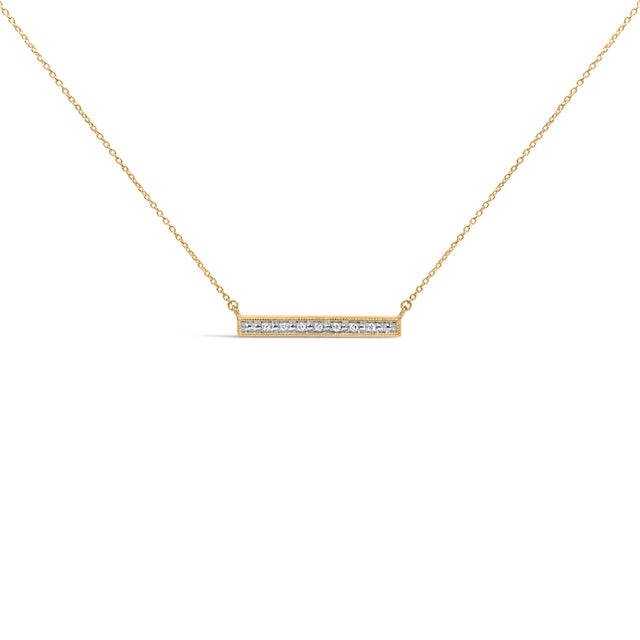 Poised at the collarbone like a stroke of light, this slim horizontal bar glows with a single row of natural diamond...