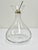 An elegant mouth-blown glass decanter paired with the Developer®: a patented wine pourer that enhances oxygenation,...