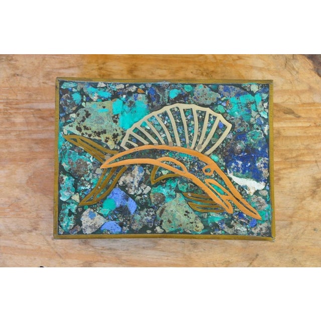 This is a beautiful brass trinket box made by Los Castillo of Taxco, Mexico in the 1950's. The top of the hand-wrought box...