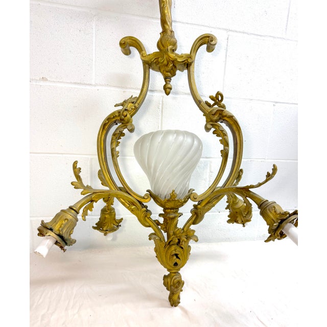 Up for sale is a very high quality antique French Louis XV chandelier made of heavy dore bronze. Dating back to the first...