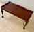 Elegant Chippendale style mahogany tea table. Raised wavy gallery border, cabriole legs with carved leaf knees and ball...