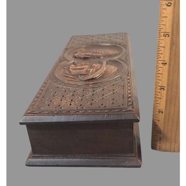 This antique hand-carved Walnut wooden glove box is a true masterpiece of early 20th-century folk art from Germany. The...