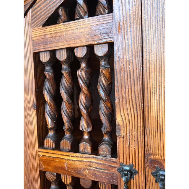 Grand 20th century Spanish cabinet constructed from pine. Features a coffered case fronted by two doors in the high part...