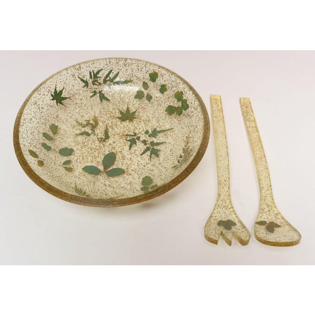 Vintage salad set including tongs/servers and bowl by Bilmar (ca. 1970s, USA). Composed of inset leaves and glitter/golden...
