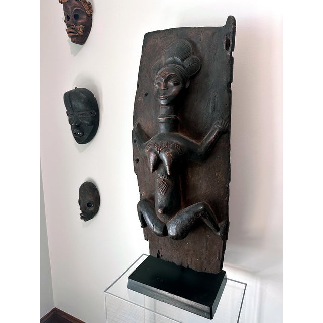 A wonderful Punu wooden door panel (one of the original pair) with the iconic carved female figure circa mid-20th century....